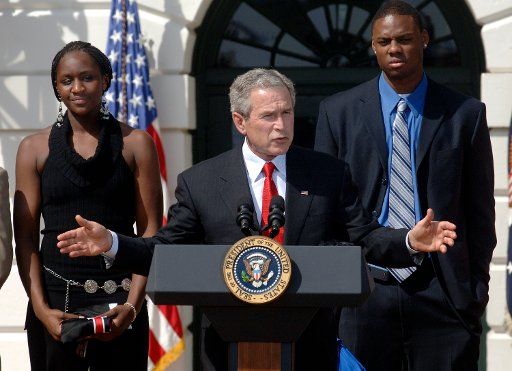 President George W. Bush greets the NCAA National Championship teams at a ceremony at the White House in Washington on April 6 2006. Bush was next to members of the men\