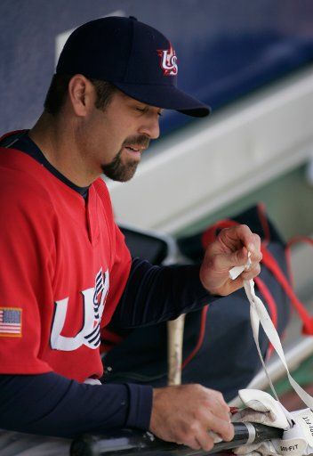 Team USA catcher Jason Varitek tapes a bat for batting practice before the game against Team South Africa in the World Baseball Classic in Scottsdale AZ March 10 2006.     (UPI Photo\/Will Powers)