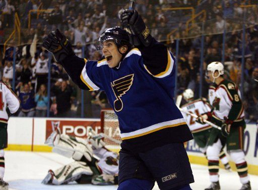 St. Louis Blues Timofei Shishkanov celebrates his first goal as a Blue as Minnesota Wild goaltender Manny Fernandez lays on the ice during the first period at the Savvis Center in St. Louis on March 10 2006. (UPI Photo\/Bill Greenblatt)