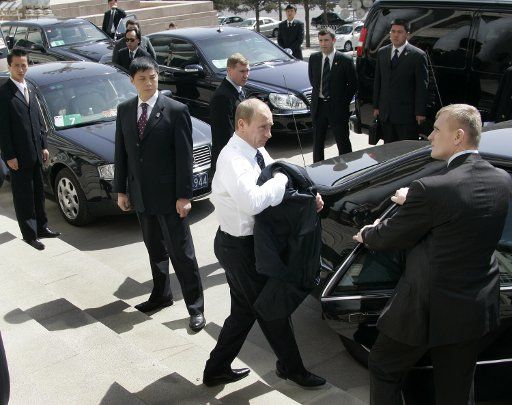 Russian President Vladimir Putin walks to his vehicle after meeting with Chinese Premier Wen Jiabao in Beijing on March 22 2006. During Putin\