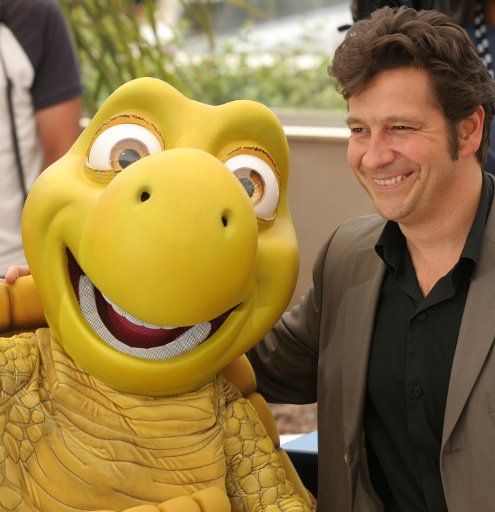 French voice impersonator Laurent Gerra arrives with a friend at a photo call for his film "Over the Hedge" at the 59th Annual Cannes Film Festival in Cannes France on May 21 2006.           (UPI Photo\/David Silpa)   