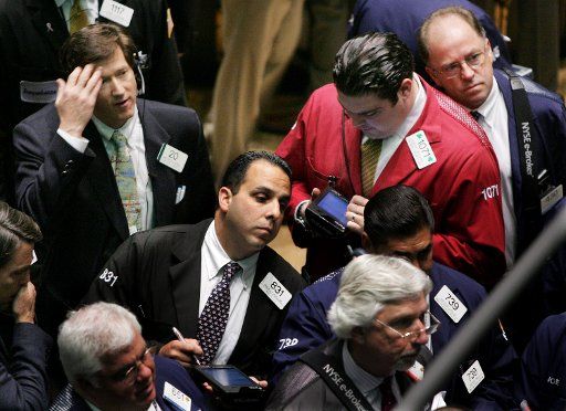 Traders conduct business on the floor of the New York Stock Exchange on June 23 2006 in New York City. (UPI Photo\/Monika Graff)