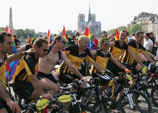 Bicyclists in the annual Gay Pride Parade ride through the streets of Paris France on June 24 2006.  An estimated 700000 people participated in this year\