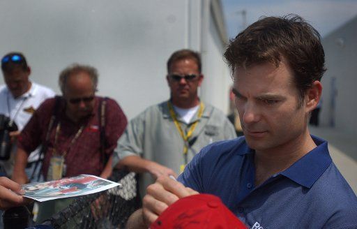 Jeff Gordon signs autographs for fans at Daytona International Speedway June 29 2006 in Daytona Beach Fla.  (UPI Photo\/Cathy Kapulka)