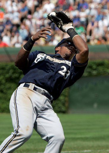 Milwaukee Brewers second baseman Rickie Week (23) grabs a fly ball during the Brewers 5-4 win over the Chicago Cubs at Wrigley Field in Chicago Il May 29 2006. (UPI Photo\/Mark Cowan)