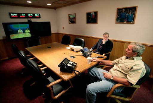 President George W. Bush (R) and National Security Advisor Stephen Hadley participate in a teleconference with Prime Minister Tony Blair of the United Kingdom on August 6 2006 at the Bush Ranch in Crawford Texas. (UPI Photo\/Eric Draper\/White House)