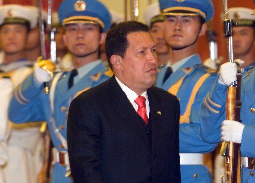 Venezuelan President Hugo Chavez inspects a Chinese military honor guard at a welcoming ceremony in Beijing\