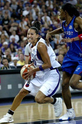 Sacramento Monarchs guard Ticha Penicheiro drives to the basket against Detroit Shock forward Swim Cash at Arco Arena in Sacramento California on September 03 2006. The Monarchs beat the Shock 89-69 in game 3 of the WNBA 2006 finals.   (UPI...