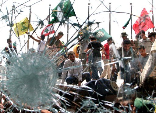 Demonstrators attack the United Nations headquarters in Beirut on Sunday July 30 2006 after Israeli jet struck a building in the south Lebanon town of Qana killing over 50 civilians. Thus far over 500 Lebanese mostly civilians have died since the...