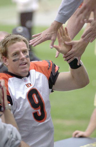 Cincinnati Bengals quarterback Carson Palmer receives high fives from Bengals fans as he runs off the field following the Bengals 28-20 win over the Pittsburgh Steelers at Heinz Field in Pittsburgh PA on September 24 2006.(UPI Photo\/Archie Carpenter)
