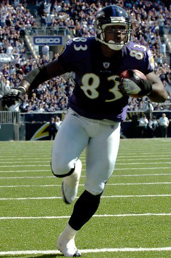 The Baltimore Ravens Daniel Wilcox (83) catches a five yard touchdown pass in the first quarter against the San Diego Chargers on October 1 2006 in a game at M&T Bank Stadium in Baltimore Maryland.  The Baltimore Ravens defeated the San Diego...