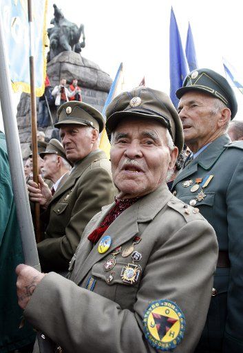 Supporters of the Ukrainian Insurgent Army (UPA) attend a rally in Kiev on October 14 2006. The rally was organized by Ukrainian partisans to receive official recognition as World War II veterans. The UPA fought both Nazi invaders and Soviet forces...