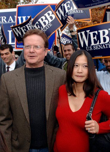 Virginia Democratic Senate candidate Jim Webb (L) and his wife Hong Le arrive at a polling location to cast their votes in the 2006 midterm elections in Falls Church Virginia on November 7 2006. (UPI Photo\/Kevin Dietsch) 
