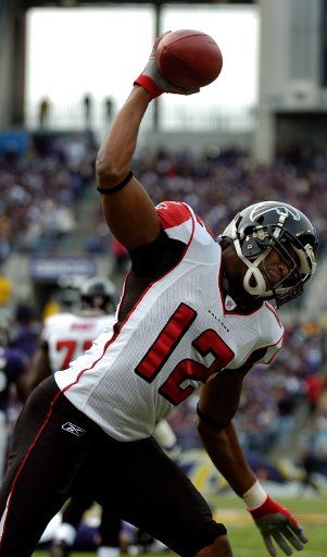 The Atlanta Falcons wide receiver Michael Jenkins (12) spikes the ball after scoring a touchdown on a 13-yard pass from Michael Vick in the first quarter against the Baltimore Ravens on November 19 2006 in a game at M&T Bank Stadium in Baltimore...