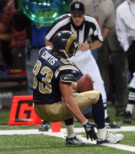 St. Louis Rams Kevin Curtis falls backwards into the endzone for a touchdown after catching a five-yard pass from quarterback Marc Bulger with 29 seconds left in the game against the San Francisco 49ers at the Edward Jones Dome in St. Louis on November...