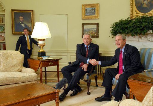 U.S. President George W. Bush shakes hands with Croatian Prime Minister Ivo Sanader after their meeting in the Oval Office of the White House on October 17 2006.   (UPI Photo\/Roger L. Wollenberg)   