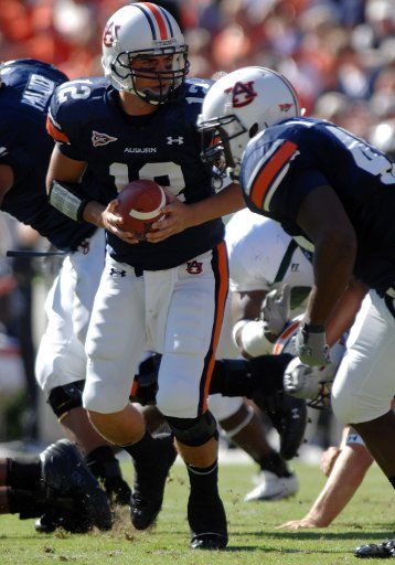 Auburn quarterback Brandon Cox (12) sets up to hand off to running back Ben Tate (44)  in the first quarter of play against Tulane at Jordan-Hare Stadium in Auburn Al. October 21 2006. (UPI Photo\/John Dickerson)