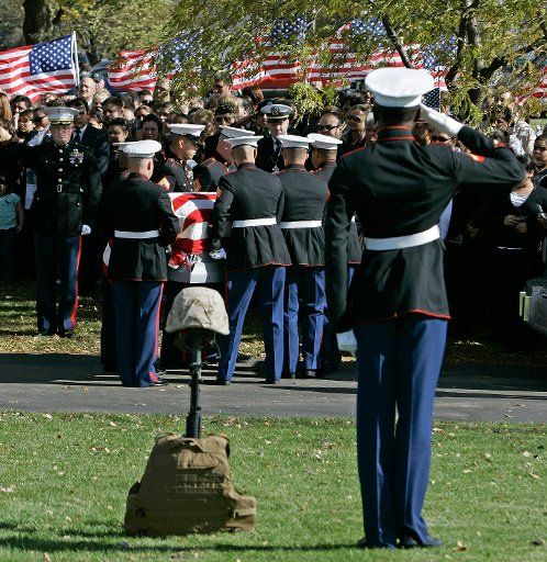 *****CORRECTED SPELLING*****   A Marine honor guard carries the casket of Lance Corporal Eduardo Lopez to his gravesite during funeral services at St. Paul Cemetery in Montgomery Illinois on October 30 2006. Lopez was killed in Iraq on October 19....