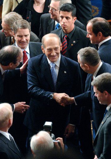 Israeli Prime Minister Ehud Olmert shakes hands with members of congress after he delivered an address to a joint session of congress in Washington on May 24 2006. Olmert said Israel would be a willing partner in peace with the Palestinians. (UPI...