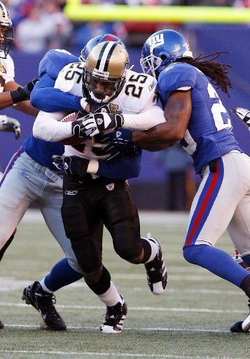 New Orleans Saints Reggie Bush breaks through the middle in the 2nd quarter at Giants Stadium in East Rutherford New Jersey on December 24 2006. The New York Giants host the New Orleans Saints in week 16 of the NFL season.   (UPI Photo\/John...