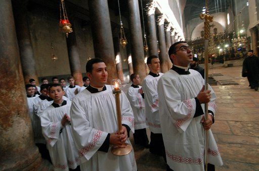 Catholic priest lead the traditional Christmas Eve procession in  the Church of Nativity where traditions says Jesus was born in Bethlehem West Bank on December 24 2006. (UPI Photo\/Debbie Hilll)