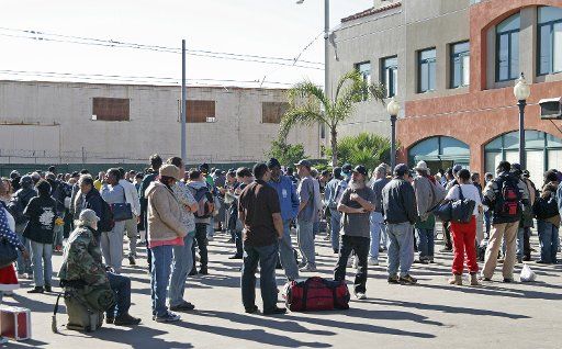 Crowds of the homeless and needy gather for the annual Christmas dinner given by Father Joe Carroll at the St. Vincent de Paul Center in San Diego on December 24 2006.   (UPI Photo\/Roger Williams)