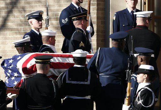 The casket of former President Gerald R. Ford is carried into the Grace Episcopal Church by the Armed Forces Body Bearers for the funeral ceremony in East Grand Rapids Michigan on January 3 2007.  (UPI Photo\/Scott R. Galvin)
