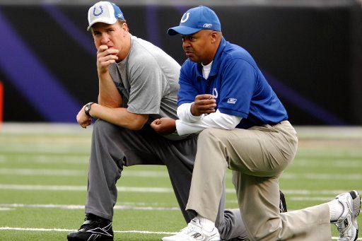 The Indianapolis Colts quarterback Peyton Manning (L) talks with quarterbacks coach Jim Caldwell (R) prior to the start of the game against the Baltimore Ravens on January 13 2007 in the divisional round of the AFC playoffs at M&T Bank Stadium in...