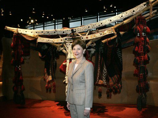 U.S. First Lady Laura Bush stands before an exhibit at the newly opened Quai Branly Museum in Paris January 15 2007. Laura Bush is in France for a three-day visit.  (UPI Photo\/Pool)