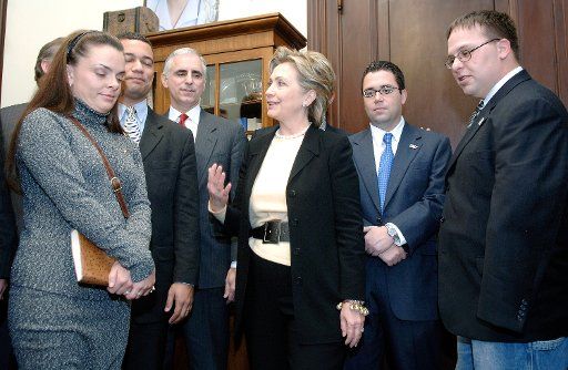 Sen. Hilary Clinton (D-NY) (C) meets with veterans of the war in Iraq who are visiting on the Hill to lobby against the Bush administration\