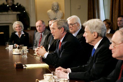 US President George W. Bush (C) speaks during a meeting with members of his administration and Congress in the Cabinet Room of the White House in Washington DC on Wednesday December 6 2006.  The Iraq Study Group presented their report to the...