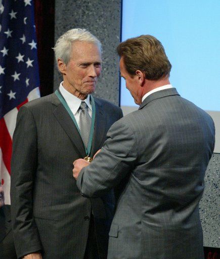 Governor Arnold Schwarzenegger awards Clint Eastwood with the Spirit of California medal during the ceremony to induct Eastwood and 12 other Californians into the California Hall of Fame at the California Museum for History Women and the Arts in...