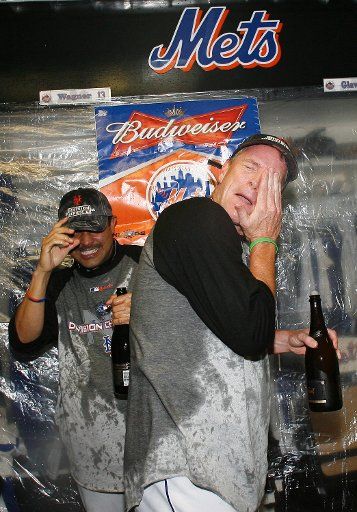 New York Mets Jose Valentin and Tom Glavine celebrate with champagne in the locker room at Shea Stadium in New York City on September 18 2006. The New York Mets Clinched the National League East Championship with a 4-0 win over the Florida Marlins....