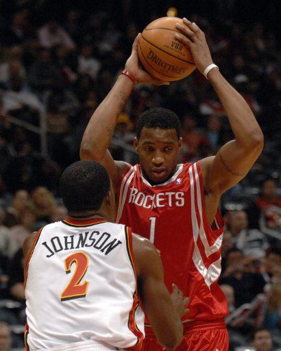 Houston Rockets Tracy McGrady (1) tries to pass off against the defense of Atlanta Hawks Joe Johnson (2) in the first period at Philips Arena in Atlanta February 23 2007. (UPI Photo\/John Dickerson)    