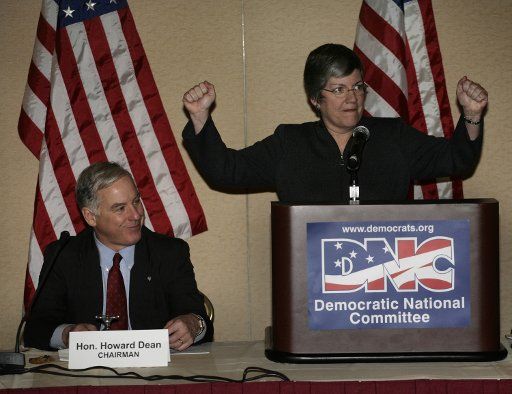 Democratic National Committee (DNC) Chairman Howard Dean (L) smiles as Gov. Janet Napolitano (D-AZ) delivers remarks at the DNC Executive Committee meeting in Washington on February 2 2007. (UPI Photo\/Yuri Gripas)