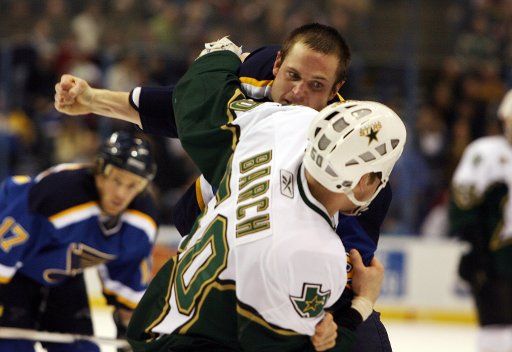 Dallas Stars Krys Barch and St. Louis Blues Matt Walker fight in the first period at the Scottrade Center in St. Louis on February 3 2007.   (UPI Photo\/Bill Greenblatt)