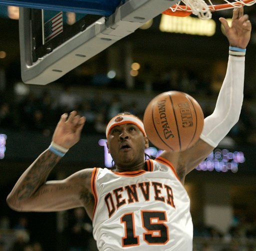 Denver Nuggets forward Carmelo Anthony dunks against the Seattle Supersonics in the second quarter at the Pepsi Center in Denver on March 28 2007.  Denver looks to hold onto its seventh place playoff position.  (UPI Photo\/Gary C. Caskey)