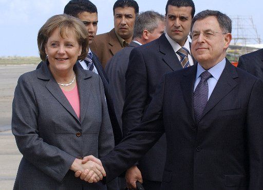 German Chancellor Angela Merkel (L) is greeted at Beirut\