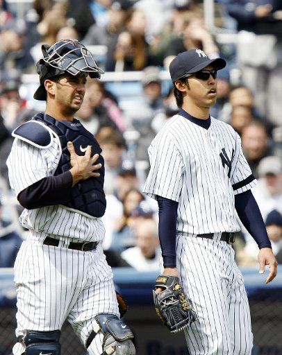 New York Yankees Jorge Posada and Kei Igawa walk to the mound in the second inning at Yankees Stadium in New York City on April 7 2007. The New York Yankees host a 3 game series with the Baltimore Orioles.  (UPI Photo\/John Angelillo)