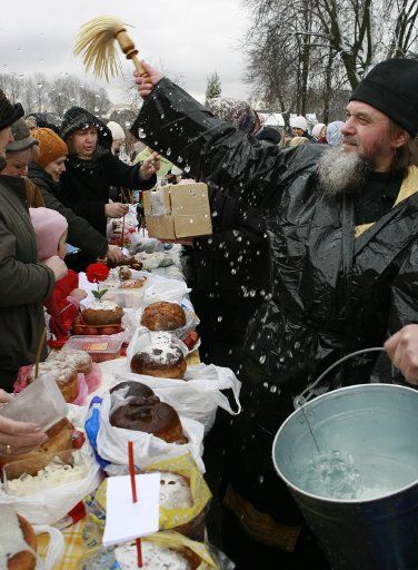 Russian Orthodox priest Alexiy blesses traditional Easter cakes and painted eggs prepared for the Easter celebration at the Peter and Paul church in Moscow on April 7 2007. The Orthodox Easter and Catholic Easter coincide this year. (UPI Photo\/Anatoli...