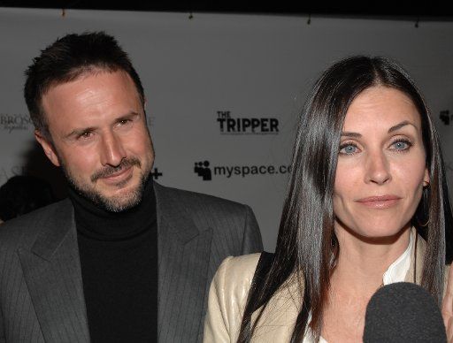 David Arquette (L) who wrote directed and acts in the political satire horror motion picture "The Tripper" and his wife actress Courtney Cox arrive for the film\