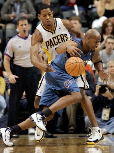 Indiana Pacers forward Danny Granger (L) knocks the ball loose from Washington Wizards forward Jarvis Hayes at Conseco Fieldhouse in Indianapolis on April 18 2007. (UPI Photo\/Mark Cowan)