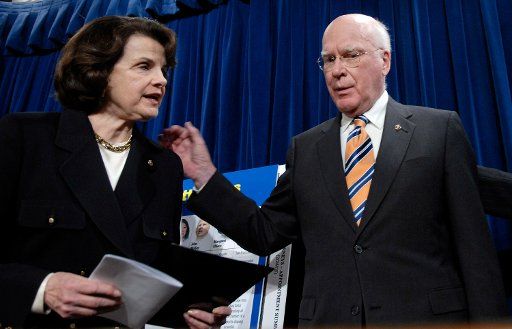 Sen. Patrick Leahy (D-VT) (R) talks to Sen. Dianne Feinstein (D-CA) following a news conference  on recently passed legislation that would mandate Senate confirmation of all newly elected U.S. Attorneys in Washington on March 20 2007. This comes in...