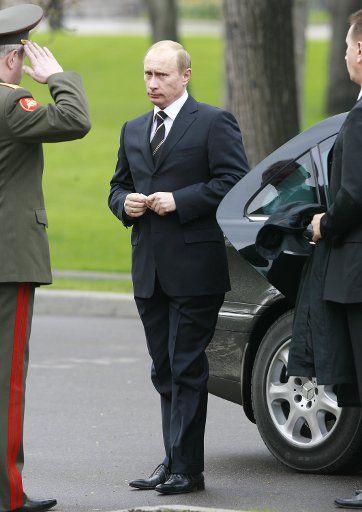 Russian President Vladimir Putin attends a wreath laying ceremony at the Tomb of the Unknown Soldier at the Kremlin wall in Moscow on May 8 2007. Russia officially celebrates its victory over Nazi Germany on May 9. (UPI Photo\/Anatoli Zhdanov)