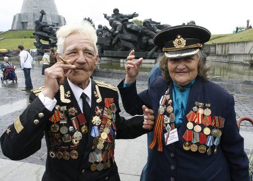 Ukrainian WWII NAVY veterans Mikhail Romanov (L) and his wife Alla attend a Victory Day celebrations in Kiev on May 9 2007. Ukraine celebrated the 62nd anniversary of the World War Two victory over Nazi Germany. (UPI Photo\/Sergey Starostenko)