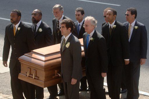 The casket containing the remains of former president of the Motion Picture Association of America Jack Valenti is carried into Cathedral of Saint Matthew the Apostle for his funeral service in Washington on May 1 2007. (UPI Photo\/Kevin Dietsch)