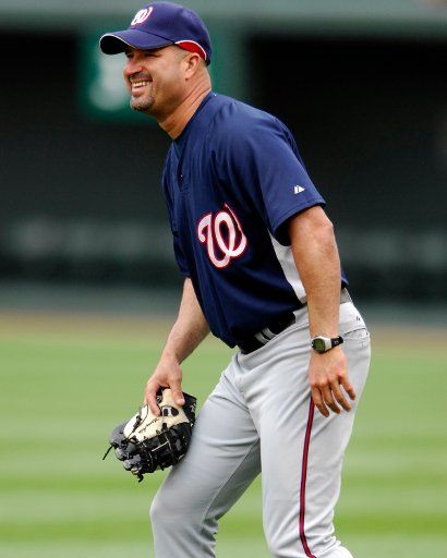 Washington Nationals manager Manny Acta shares a laugh on the field with his team during batting practice prior to the game against the Baltimore Orioles on June 14 2007 at Orioles Park at Camden Yards in Baltimore. (UPI Photo\/Mark Goldman)