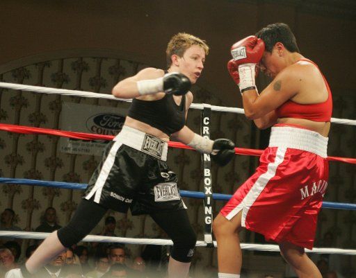 Four time world champion Layla McCarter (left) of Las Vegas attacks Angelica Martinez of New Mexico during their fight at Orleans Hotel and Casino in Las Vegas on May 25 2007. McCarter won by decision. (UPI Photo\/Roger Williams)