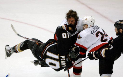 Ottawa Senators Mike Fisher (top) receives a roughing penalty for knocking the Anaheim Ducks Corey Perry to the ice in the first period of game two in the Stanley Cup final May 30 2007 in Anaheim California. (UPI Photo\/Phil McCarten)