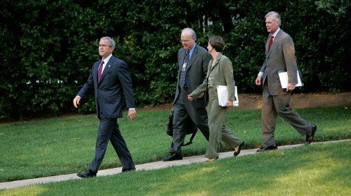 U.S. President George W. Bush (L) leads his advisers as he departs the White House in Washington for Andrews Airforce Base and on to Philadelphia on July 26 2007. With the President are Karl Rove Deputy Chief of Staff Candi Wolff Assistant to ...